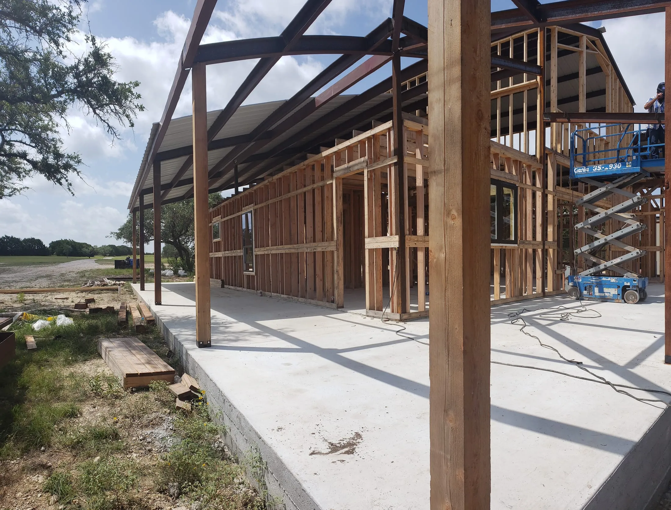 Framing and exterior steel work underway on a custom home.